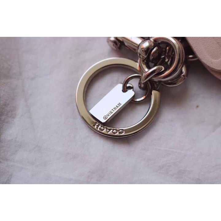 Charm chạm đeo túi và móc khóa Coach bướm