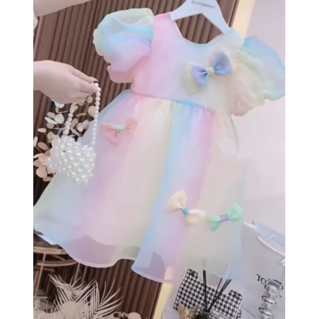Váy nơ nhỏ cầu vồng cho bé giá cả yêu thương -A49