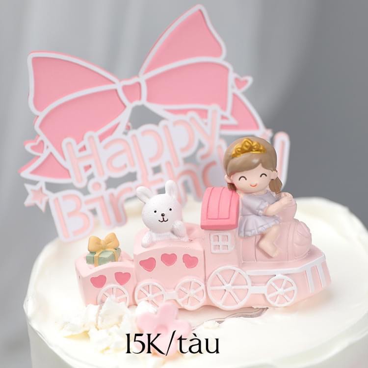 Mô hình em bé gái lái tàu hồng trang trí bánh kem