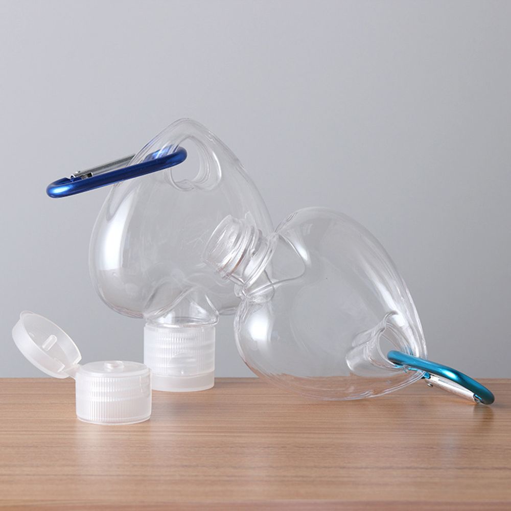 Lọ rỗng trong suốt hình trái tim 50ml đựng nước hoa/sữa dưỡng da có thể đổ đầy lại kèm móc kim loại dùng khi đi du lịch