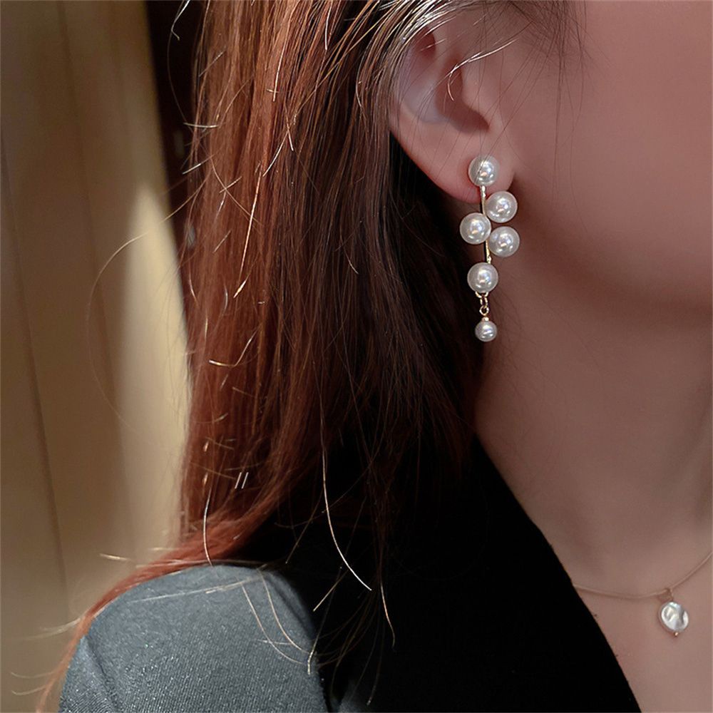 Khuyên tai dáng dài đính ngọc trai phối tua rua thời trang cho nữ