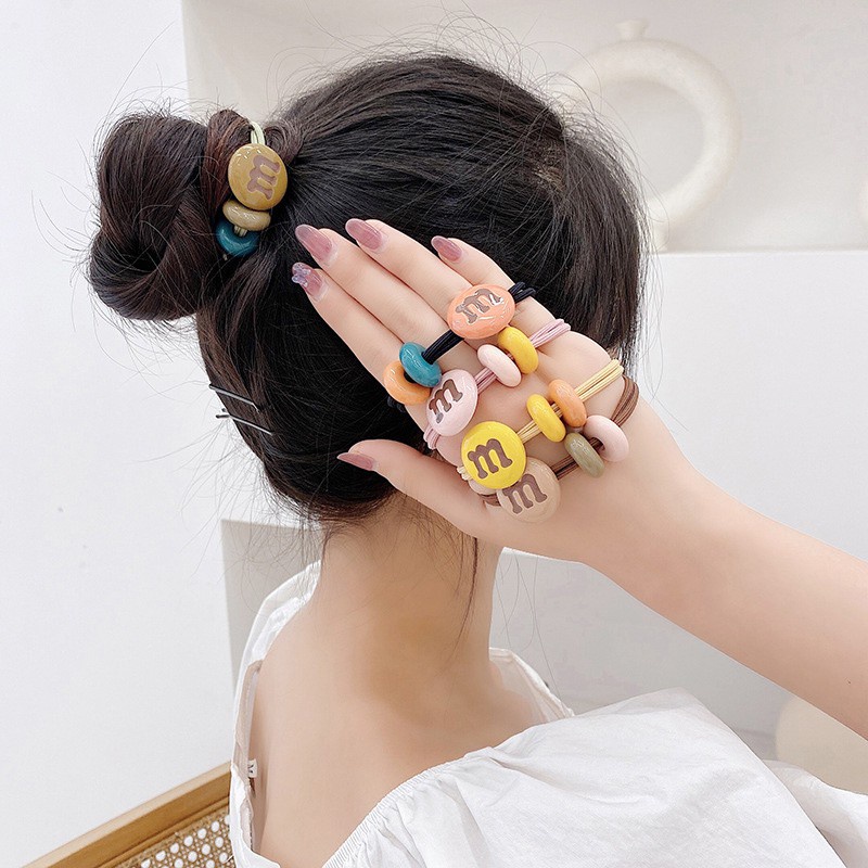 Dây cột tóc họa tiết chữ M đáng yêu tiện lợi dành cho nữ