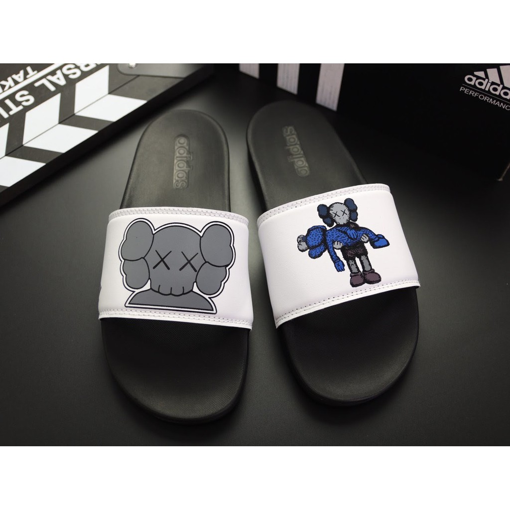 Dép adidas plus kaws đen quai trắng nam