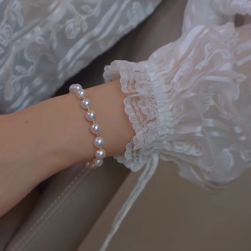 Vòng tay ngọc trai nhân tạo tròn đều 8ly mix bi titan