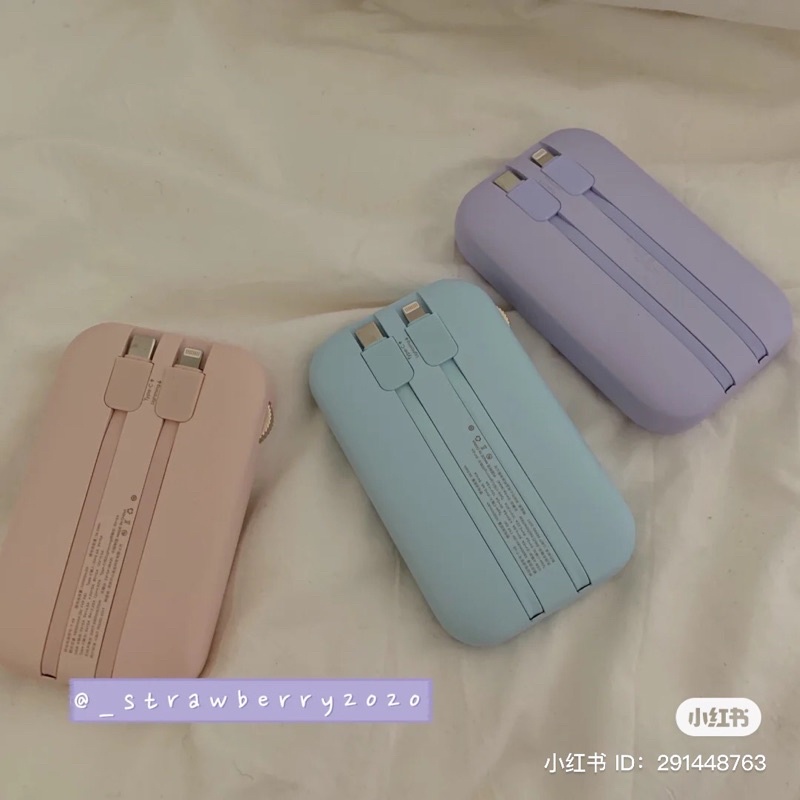 Sạc pin dự phòng không dây có hai dây cắm màu pastel