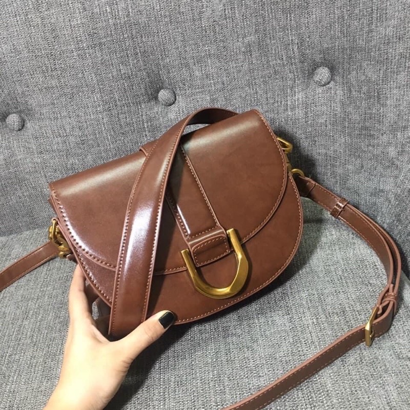 Túi Yên Ngựa CNK Nâu Socola Mới Nhất Gabine Saddle Bag