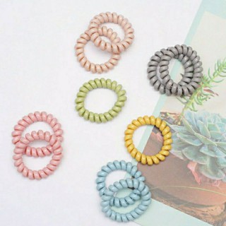 Cột tóc lò xo màu pastel