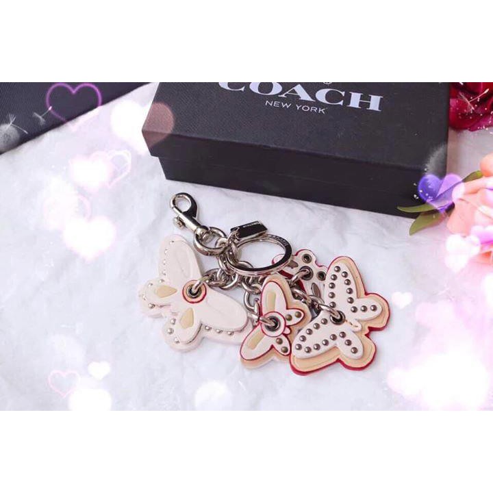 Charm chạm đeo túi và móc khóa Coach bướm