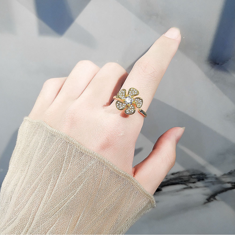 Nhẫn Hở Hình Hoa Nhỏ Dạng Xoay Đính Đá Zircon Thời Trang