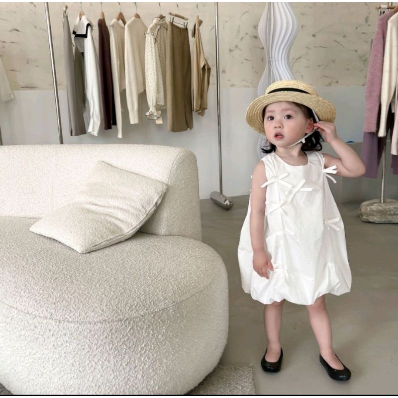 Đầm bí trắng nơ nhí