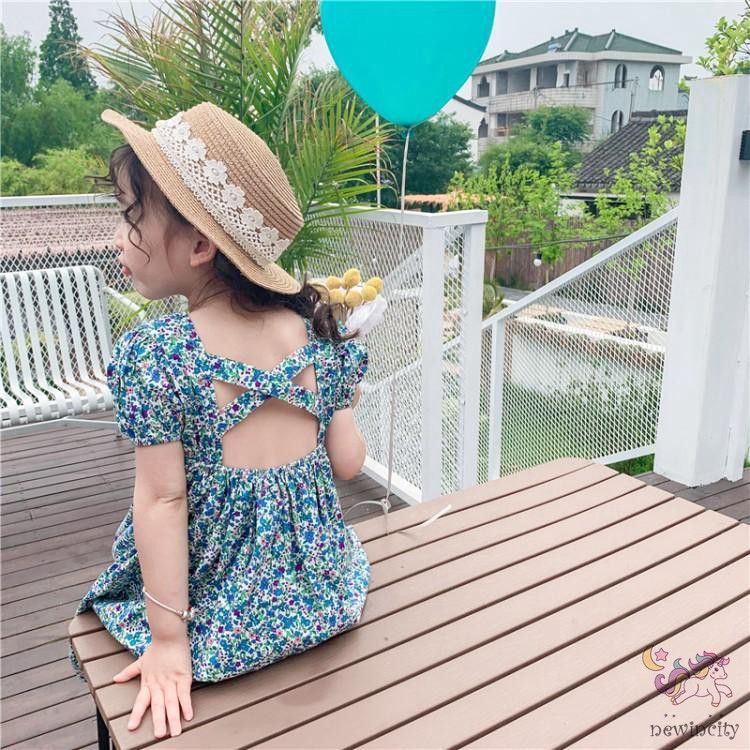 Đầm hoa hở lưng cho bé gái