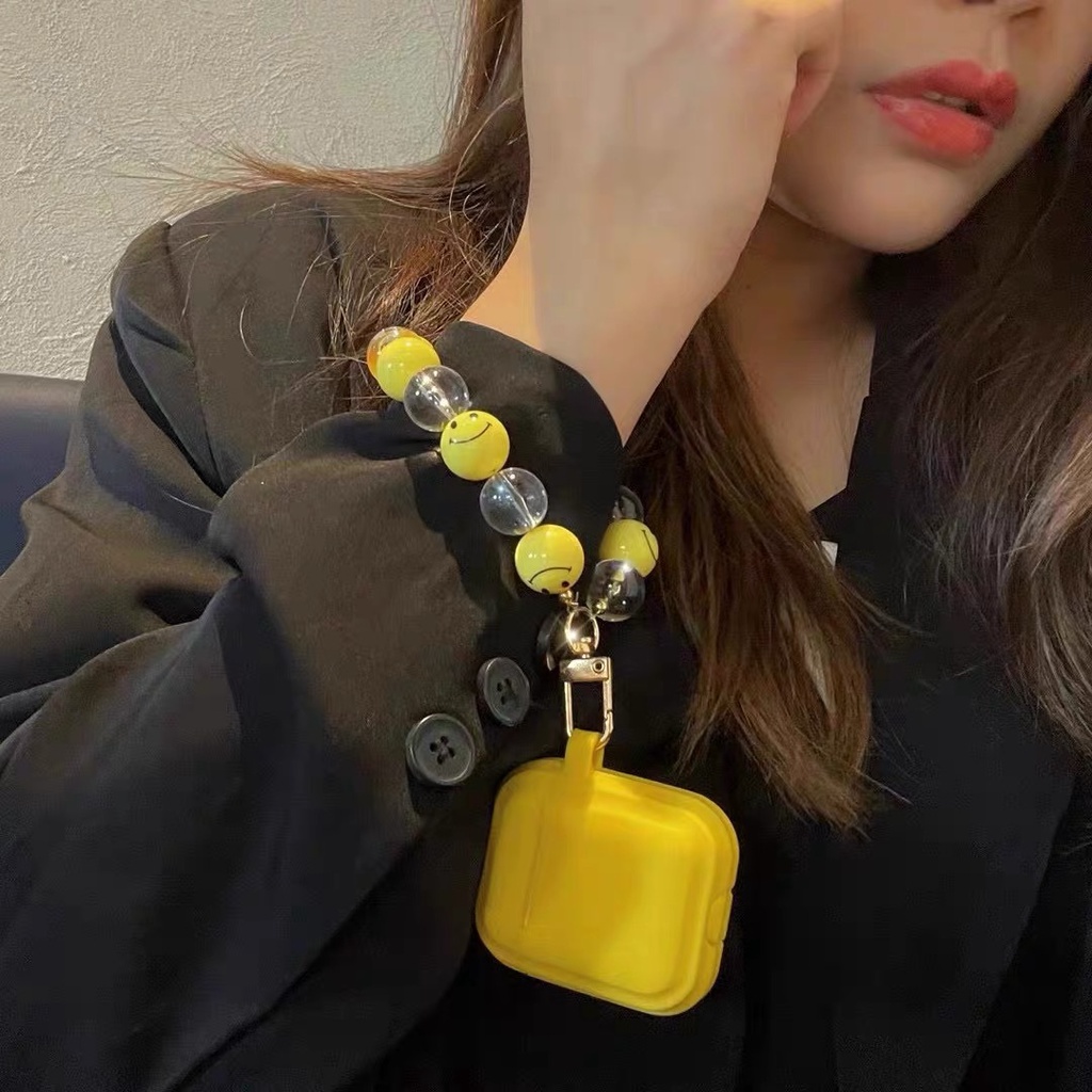 Vỏ hộp sạc tai nghe Bluetooth Airpods 1/2 gắn chuỗi hạt mặt cười bằng TPU màu vàng