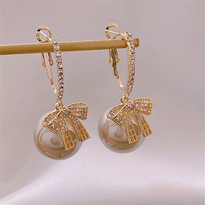 Khuyên tai nơ đính ngọc trai thiết kế mới 2021