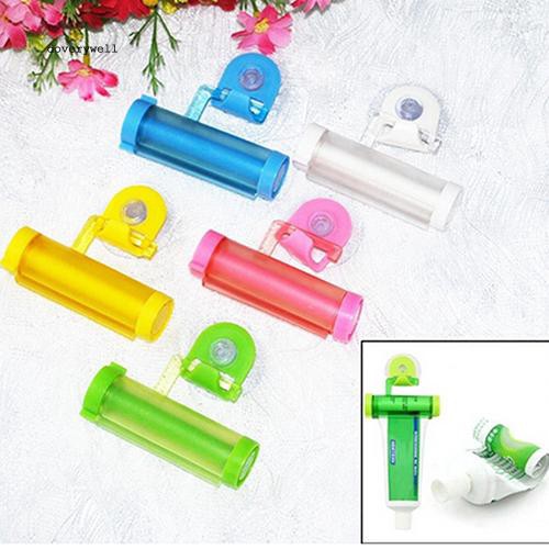 Dụng cụ lăn ép kem đánh răng có giác hút gắn tường