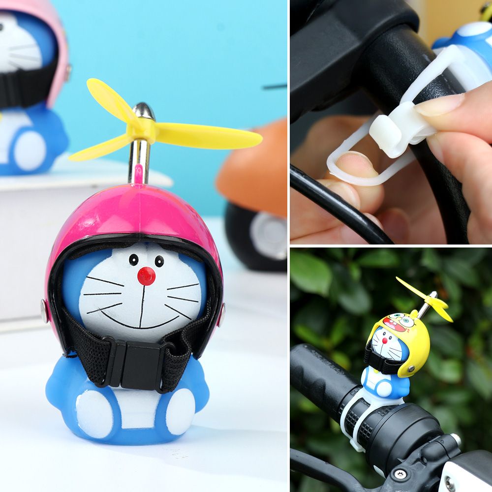 Búp bê doraemon đội mũ bảo hiểm có đèn cho xe hơi xe máy