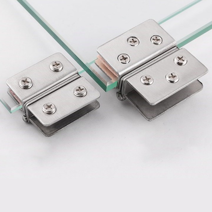 Bản Lề Kẹp Cửa Kính Inox - Bản Lề Kẹp Cửa Kính Inox kết nối hai tấm kính lại với nhau và dễ dàng đón