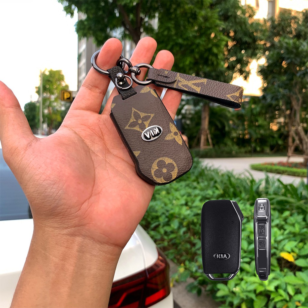 Đựng smartkey Kia Cerato 3 nút bấm handmade da LV KC3V AD có tay cầm