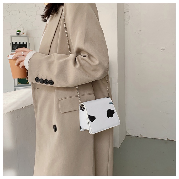 Túi xách nữ đeo chéo mini họa tiết bò sữa dây đeo chuỗi xích cá tính