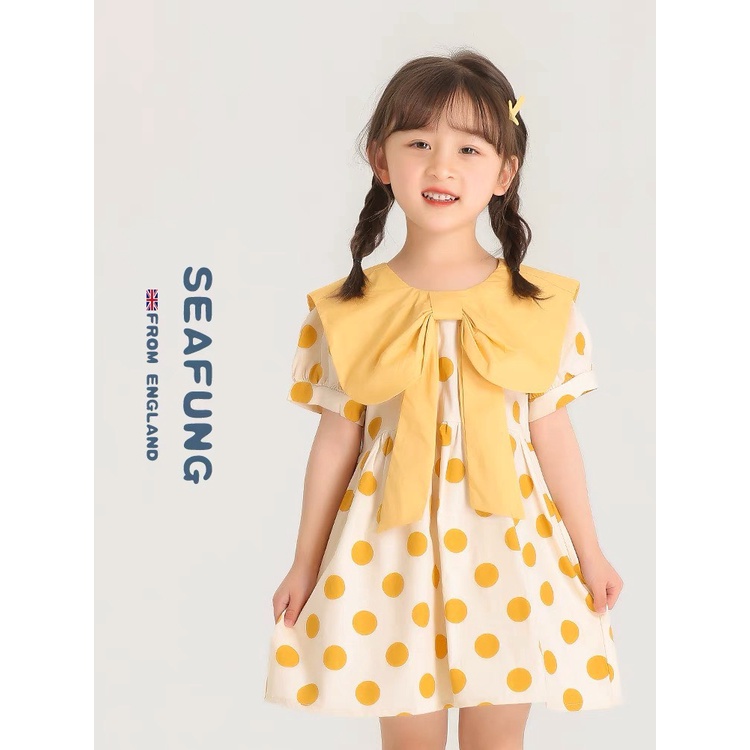 Váy chấm bi vàng cổ nơ cho bé gái chất đũi mềm mát và thấm mồ hôi
