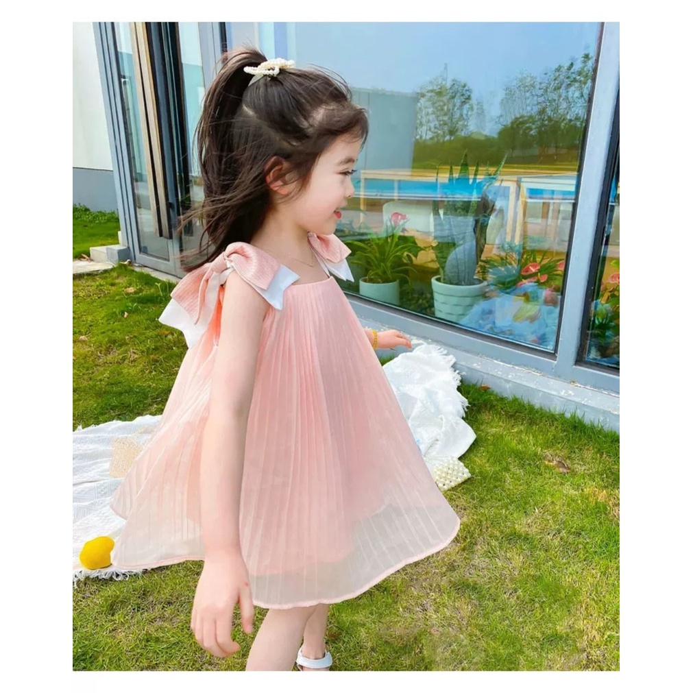 Váy xòe bé gái dập ly nơ vai điệu đà cho bé