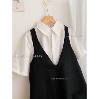 Set sơ mi trắng váy yếm đen