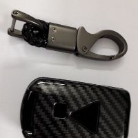 Bọc khóa vân cacbon Mitshubishi Xpander/Outlander