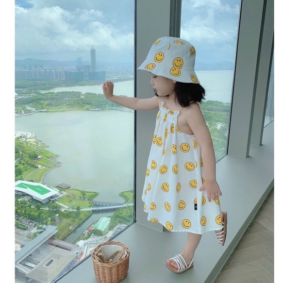 Váy bé gái 2 dây ICON mặt cười xinh xỉu đi biển kèm mũ đội đầu