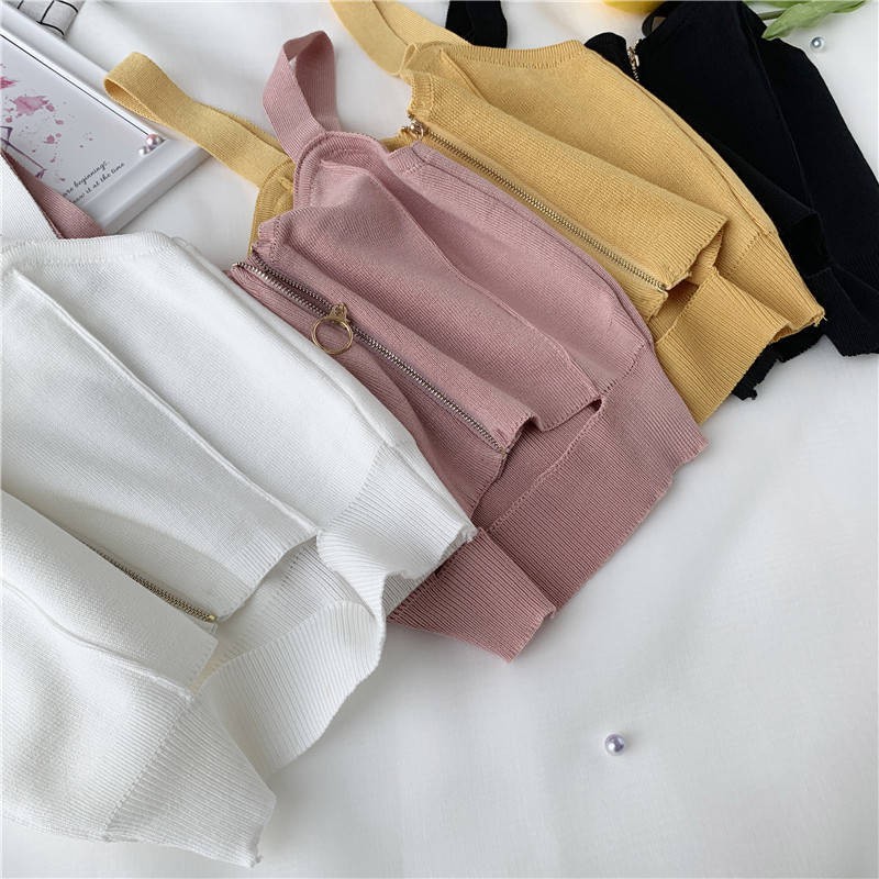 Đan ngắn màu đen thắt lưng thon gọn giảm béo dây treo nữ Hồng Kông hương kéo khe không tay áo vest dưới gợi cảm