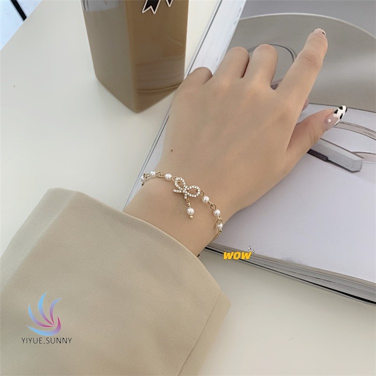 Vòng Tay Thắt Nơ Đính Ngọc Trai Thời Trang Dành Cho Nữ