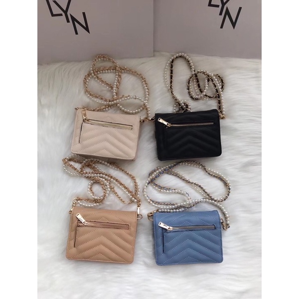 Túi lyn khoá tròn mini đeo chéo dây hạt ngọc