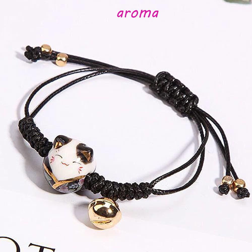 Vòng Đeo Tay Bện Dây Đỏ May Mắn Mặt Sứ Hình Mèo May Mắn Có Chuông Cho Nữ
