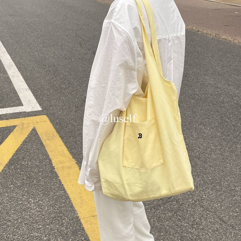 Túi đeo vai vải canvas màu vàng nhạt phong cách hè dành cho nữ