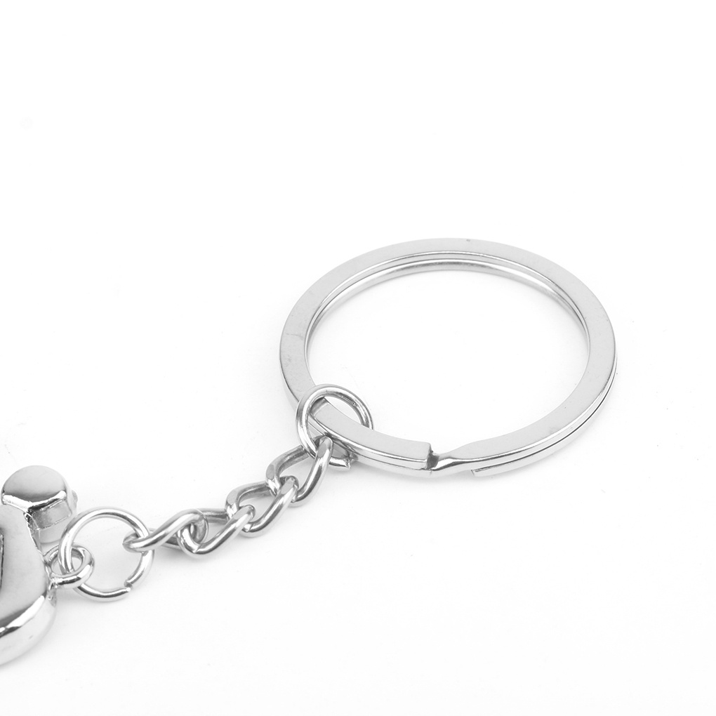 Móc khóa bằng kim loại màu bạc hình người chạy xe đạp độc đáo