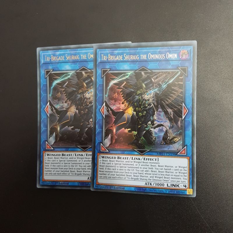 Lá bài Tri-Brigade Shuraig the Ominous Omen - MP21-EN198 - Ultra Rare 1st Edition
