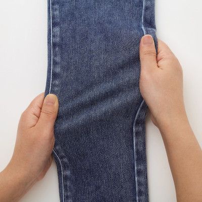 Quần UNQL chất jean thun wash màu loang dáng skinny lưng bảng thun to có 2 túi sau