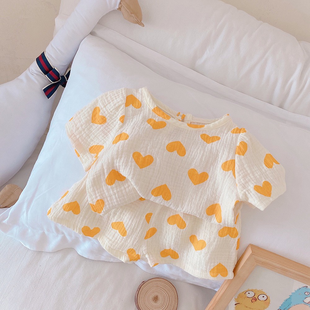 Bộ đồ bé gái mùa hè thoáng mát họa tiết trái tim, vải mềm thấm hút, hàng Quảng châu cao cấp