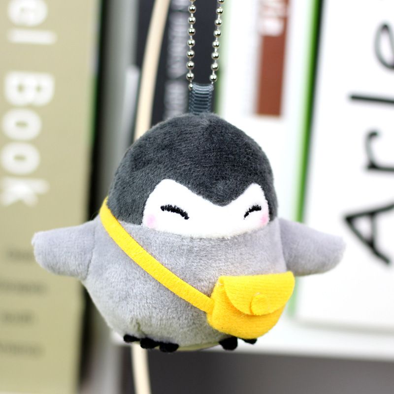 Móc khóa thú bông chim cánh cụt mang túi
