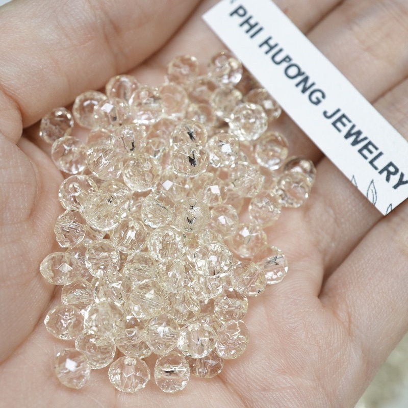Gói 100 hạt cườm nhựa 6mm vàng trà đính áo, xỏ vòng