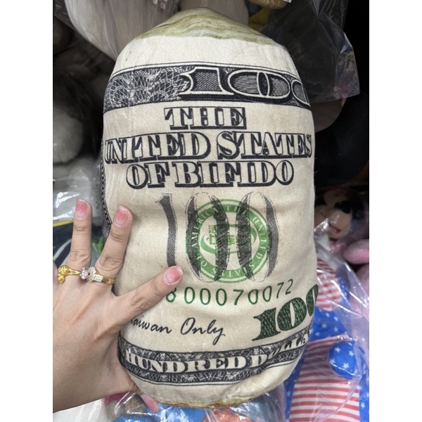 Gấu bông gối tiền dollar