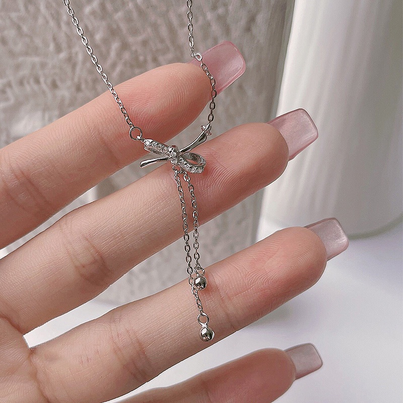 Dây chuyền mặt hình nơ đính đá pha lê nhân tạo phối tua rua xinh đẹp thời trang làm quà tặng dành cho nữ