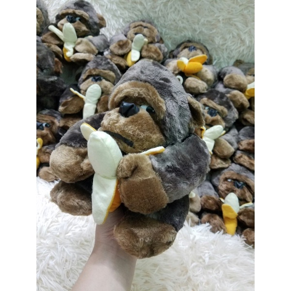 Gấu bông con khỉ ăn chuối giống như thật