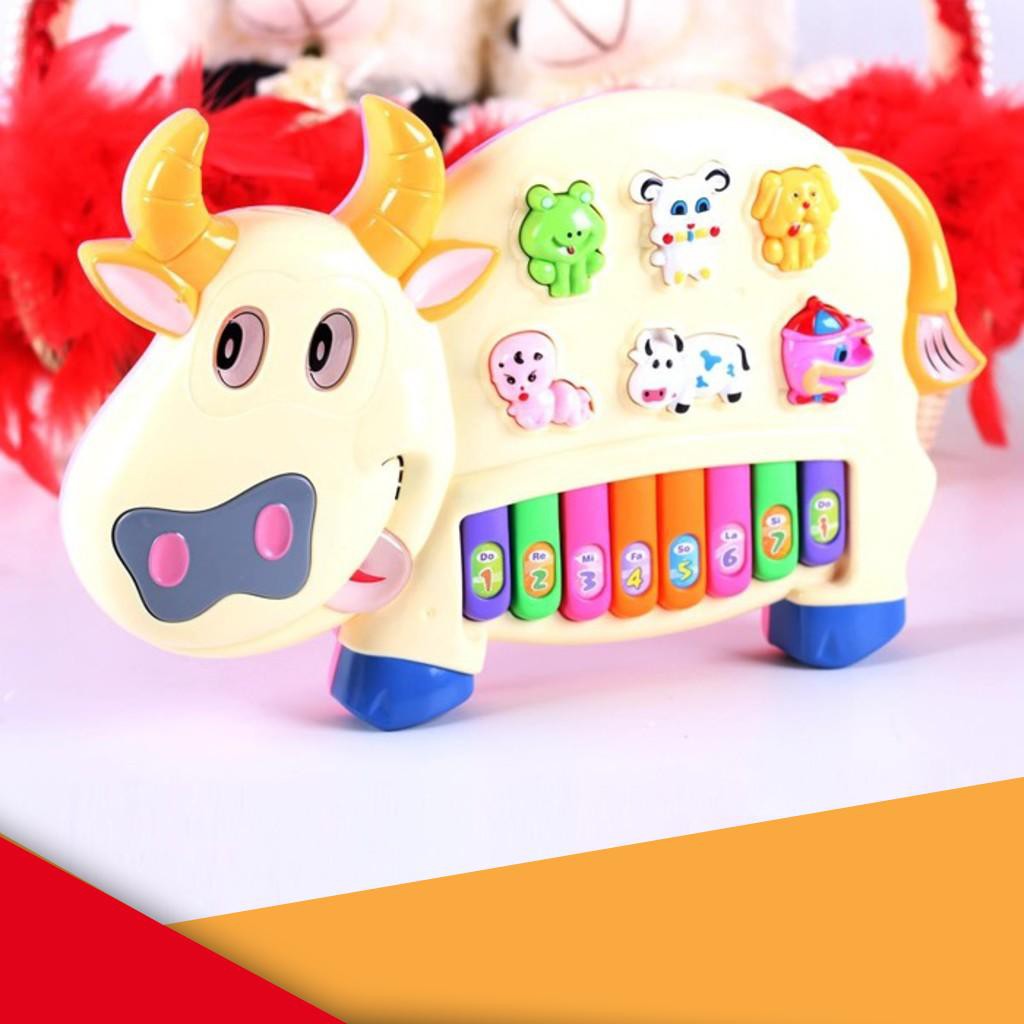 Đồ chơi đàn piano hình chú bò sữa cho bé xanh