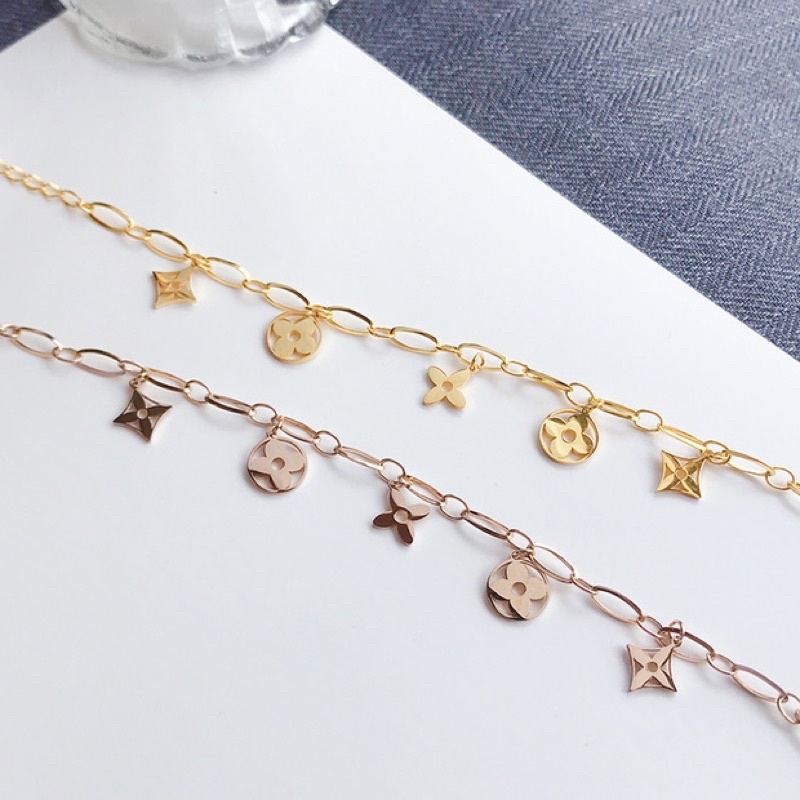 Lắc tay/Vòng tay titan hoa lv rỗng