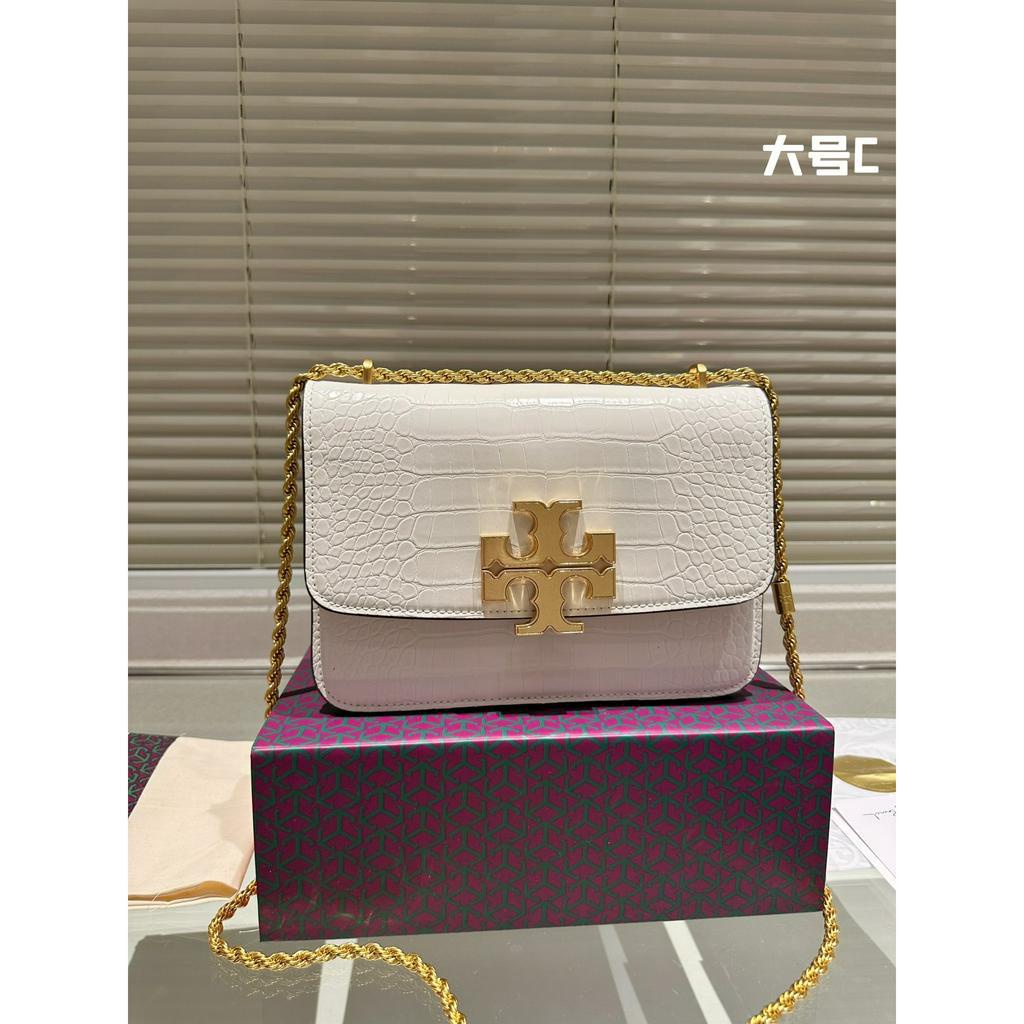 Túi xách Tory Burch tag vàng nhiều màu cả da trơn và da dập vân.