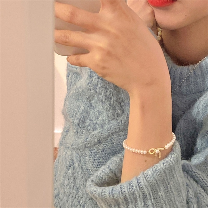 Vòng tay đính nơ và ngọc trai giả tinh tế thiết kế tinh tế cho nữ