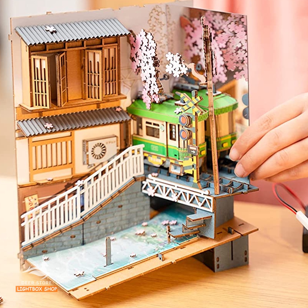 Mô hình Book Nook tự lắp ráp bằng gỗ Rolife Sakura Densya. Đèn có công tắc cảm ứng. TGB01