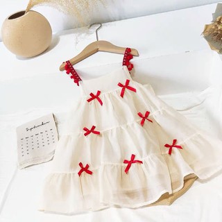Váy 2 dây đính nơ đỏ siêu xinh