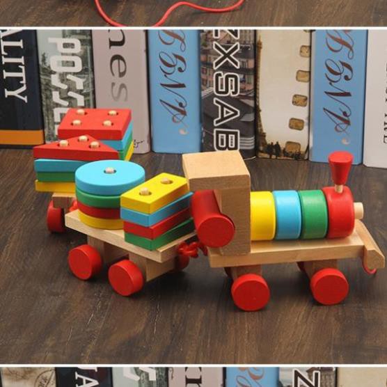 Đồ chơi tàu hỏa chở khối gỗ thả hình trụ cho bé