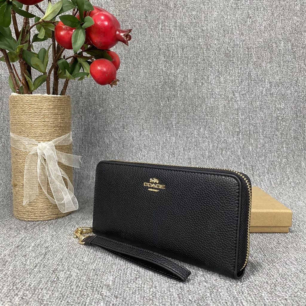 Ví dài nữ cầm tay Coach xuất xịn có quai đeo cổ tay chất liệu da thật cao cấp