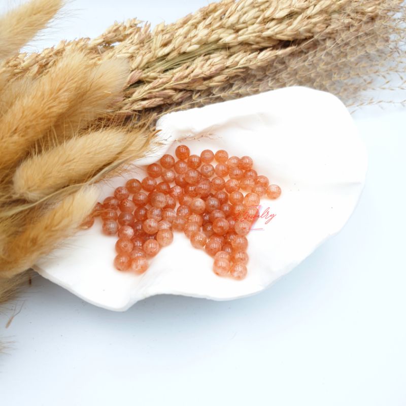 1 hạt đá màu ánh cam Mặt Trời